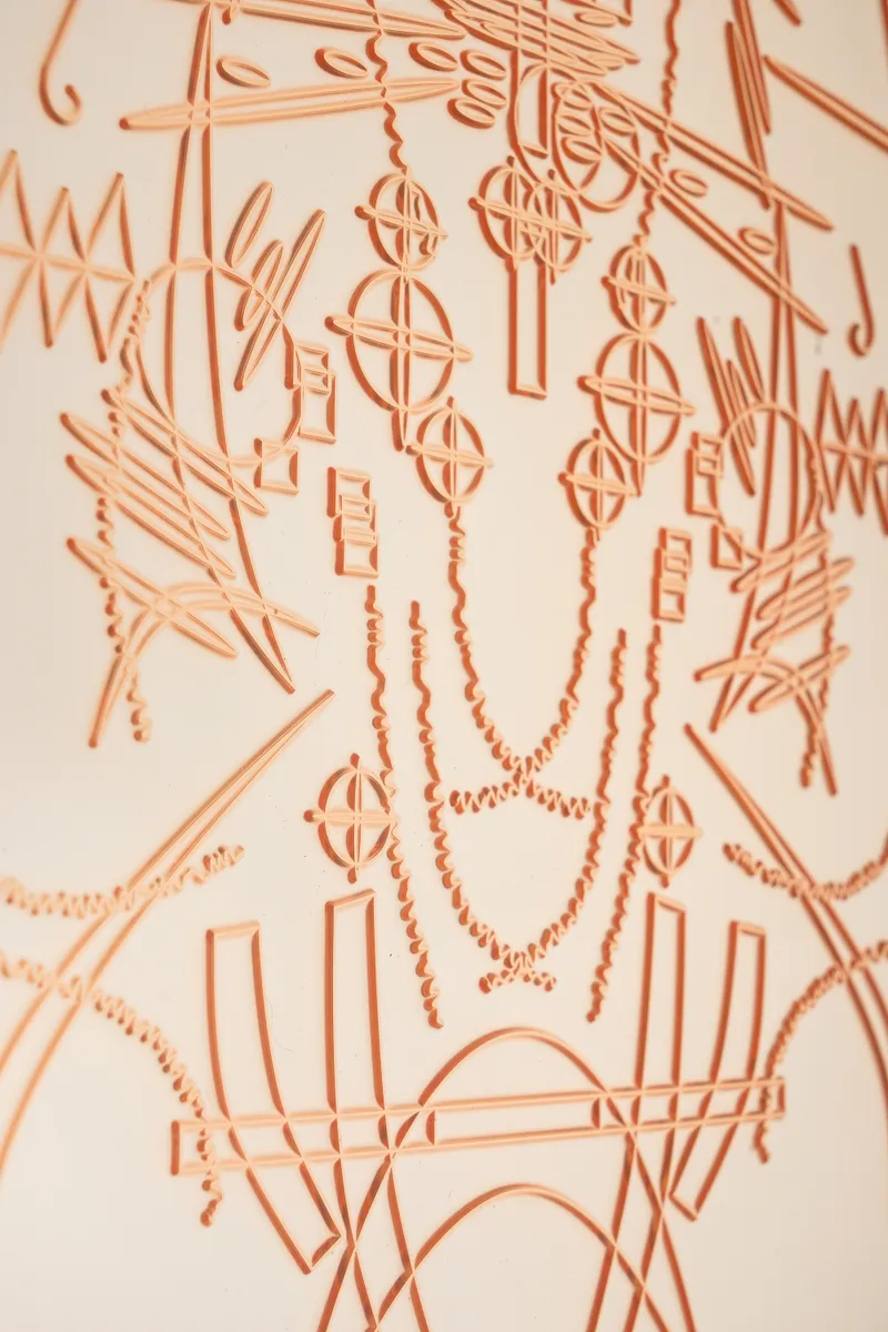 Detail of a relief of orange interlocking forms